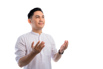 Religious Asian Muslim man praying with raised hands isolated on transparent background. Ramadan and Eid Fitr celebration concept