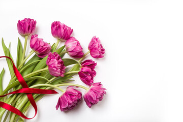 Bouquet of pink tulips on white background. Copy space