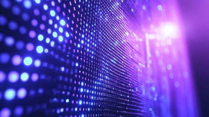 Abstract digital display wall with vibrant glowing dots.  A close-up view of a dynamic LED screen, showcasing a mesmerizing array of luminous blue and purple circular dots