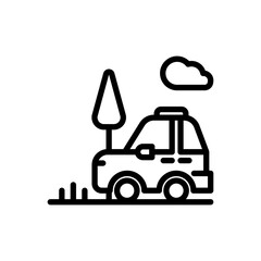 Naklejka premium A car is driving down a road with a tree in the background. The sky is cloudy, and the car is parked on the side of the road