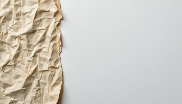 Everyday objects - for downstream advertisement and design: A crumpled piece of aged paper sits alongside a clean, white surface, creating a stark contrast of texture and color.
