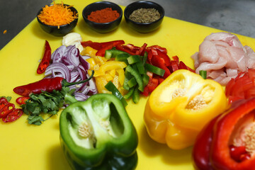 chopped vegetables on a board, ingredients, pepper