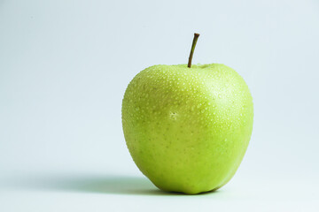 one green apple on a white background
