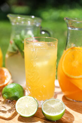 a glass of iced lemonade with lime and orange