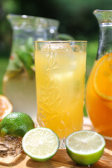 a glass of iced lemonade with lime and orange