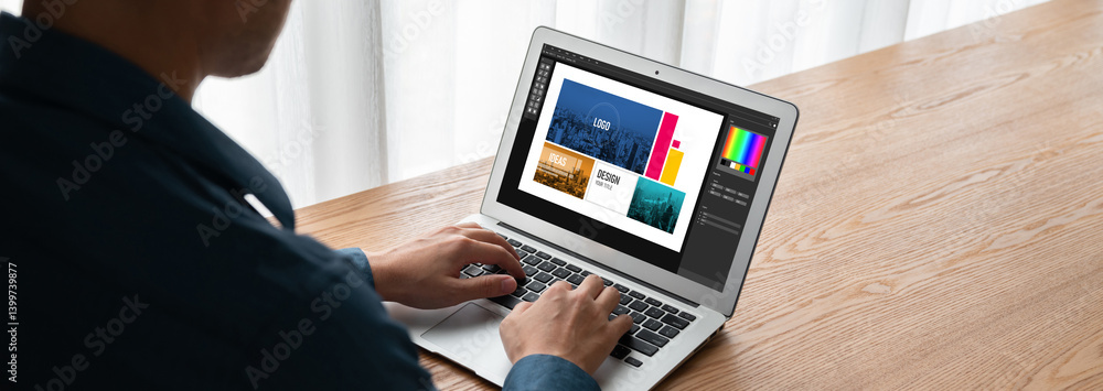 Poster graphic designer software for modern design of web page and commercial ads showing on the computer s