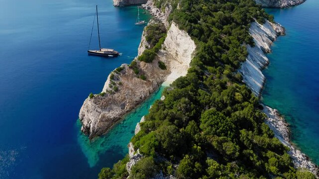 Slow panning drone shot of a beautiful secluded beach in Ithaca island, Greece