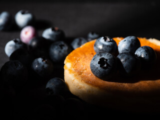 Ripe Blueberries on pancakes fruit macro close up