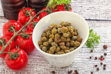 Marinated green capers in the bowl