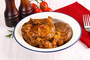 Italian cuisine - ossobuco with sauce