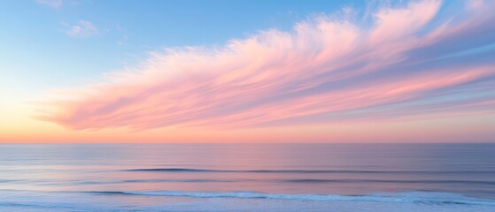Pink sunset clouds over ocean waves