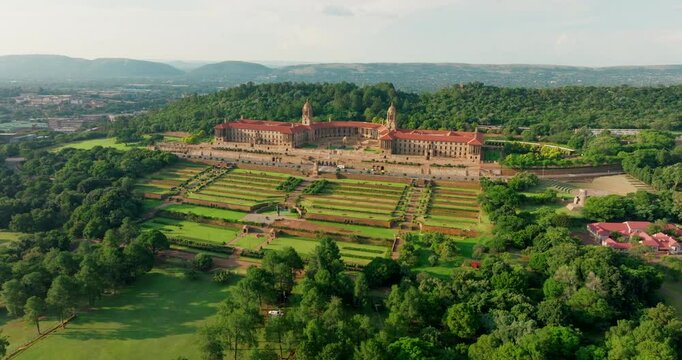 Establishing shot of Union Buildings in Pretoria city, capital of South Africa, with gardens landscape. Stunning views of historic architecture and government office. 4K drone wide orbit footage