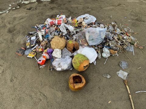 The problem of trash on the beach. Beach pollution.