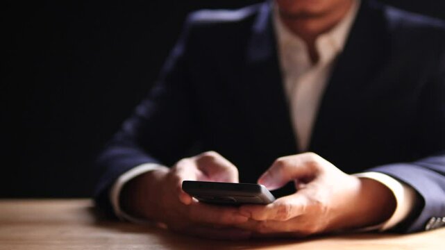 Businessman using mobile smartphone finger touching on phone screen, mobile banking, online shopping, social media, chatting with AI, customer support. Concept of technology, digital communication