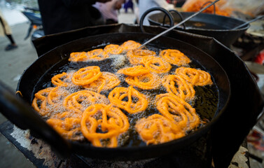 Vendor makes Jalebi Indian sweet food