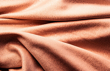 Minimalist background in light pink fabric, offering a calm and elegant aesthetic.