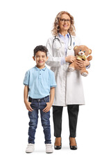 Full length portrait of a female doctor standing with a kid