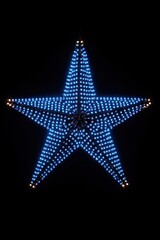 Obraz premium Illuminating Blue Star Ornament in the Dark