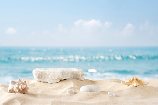 Stone podium for summer cosmetics product presentation on blurred tropical sea sand beach background