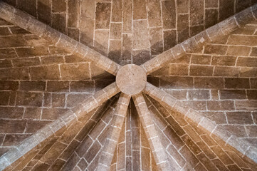 Obraz premium Stone ceiling architecture detail showing ribbed vaulted design with symmetrical pattern and aged historic texture