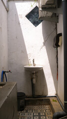 Obraz premium sink and faucet with golden hour shadow