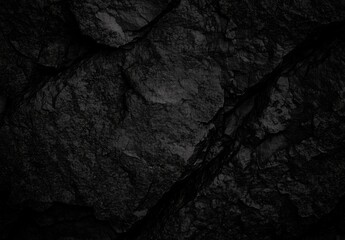 Dynamic Black Rock Surface with Textured Patterns in Shadows Evoking Mystery
