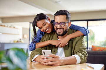 Happy couple using smartphone together