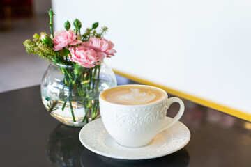 cup of coffee and flowers
