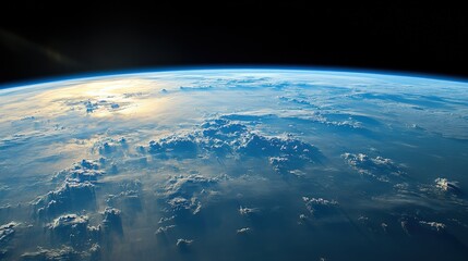 Fototapeta premium Stunning Earth View from Space: Blue Planet with Cloud Patterns and Sunlight