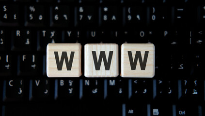 WWW text on wooden cubes on black keyboard