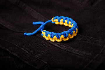 Blue yellow macrame bracelet. Wristband in national Ukrainian flag colors on black jeans fabric...