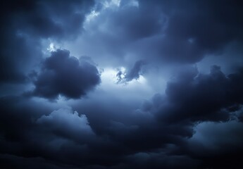 Dark Stormy Clouds Gather Over the Horizon with a Hint of Light Breaking Through