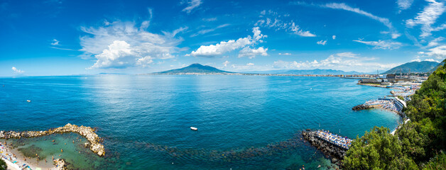 Castellammare di Stabia beach in the Gulf of Naples, with vesuvius in the distance in a sunny and...