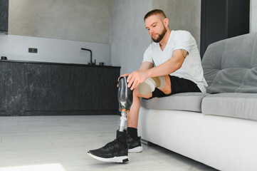 portrait of man with prosthetic leg sitting
