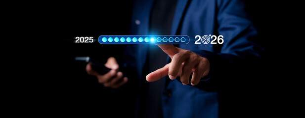 Goal Setting in 2026,  Businessman Touching Progress Bar from 2025 to 2026, New Business Startup, Business Growth Goals, New Challenges, Planning and Strategy Creating Growth Opportunities.