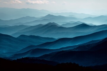 Rolling Mountain Range Silhouette with Hazy Blue Atmospheric Perspective Scenery