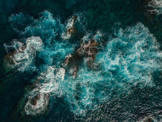 Aerial View of the Sea and Waves. The vast ocean stretches endlessly, with waves. Nature, tranquility, and adventure.	