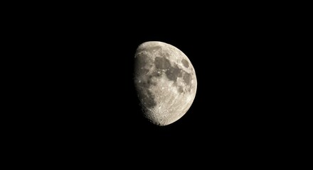 Waning gibbous moon in dark sky
