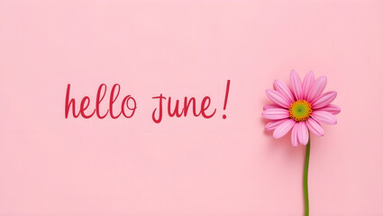 Photograph of a simple greeting card with a pink background and the words "hello June!" written in a playful, cursive font. The words are centered on the card and written in a dark red color. 