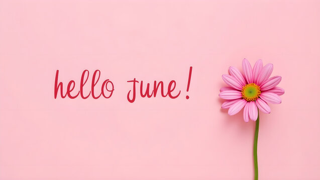 Photograph of a simple greeting card with a pink background and the words "hello June!" written in a playful, cursive font. The words are centered on the card and written in a dark red color.  - Powered by Adobe