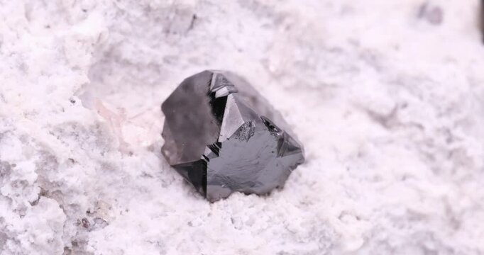 Bixbyite crystal. Specimen from Cubic #2 claim, Thomas Range, USA. Micro footage extreme close-up. microscope mineral crystal photography for Scientific use.