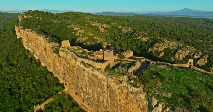 Mornas Fortress stands majestically on top of a rocky cliff. The Fortress of Mornas is a medieval fortress above the village of the same name in the French department of Vaucluse