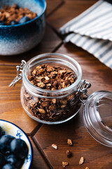 Granola with chocolate, nuts and fresh blueberries. Healthy and simple breakfast.
