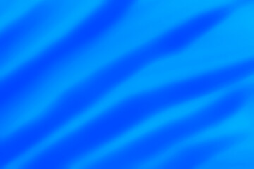 waved backdrop: close up of blue color liquid watercolor paint brush strokes