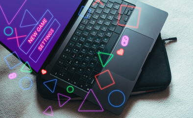 Laptop with gaming interface on screen. Playing online concept with empty space for text. Online entertainment and gamification.