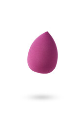 makeup sponge a fuchsia shade suspended mid-air with a soft shadow beneath, giving floating effect