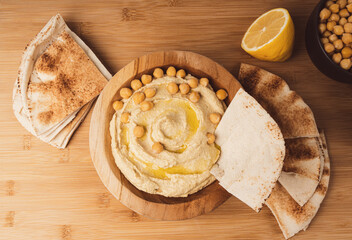 Hummus in bowl, houmous dip, chickpea humus tahini sauce, middle eastern spread