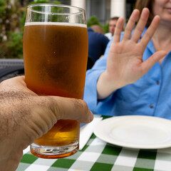 Reject a glass of beer, woman refusing alcohol, stop drinking, sobriety concept, saying no to beer...