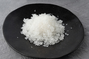 Dead sea salt pile, white crystals for body spa, sodium chloride similar to crushed ice, spa scrub