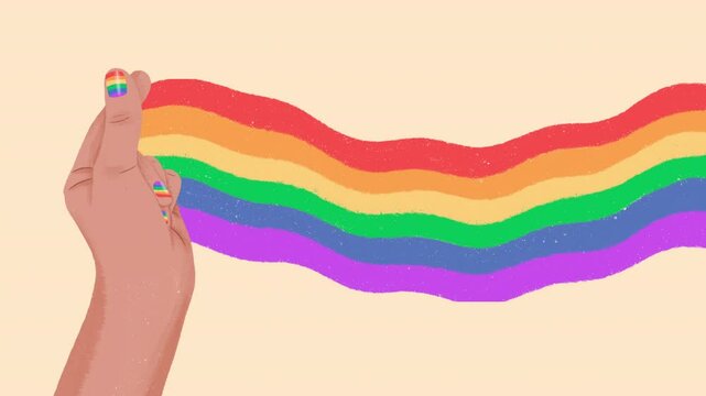 Hand showing mini pride flag on beige background